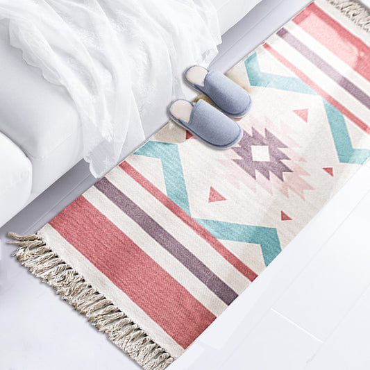 Warm terracotta boho rug with fringe under bed in a bright bedroom with natural light.

