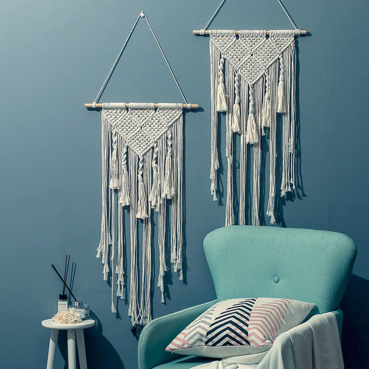 Living room wall hanging decor above sofa in modern living room setting
